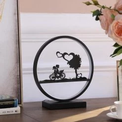 13 in. Girl And Boy On Bicycle LED Accent Table Lamp by ORE International -Armacost Lighting Shop matte black ore international table lamps hbl2155b 44 1000