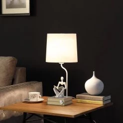 Modern Reader Sitting Stack of Books Polyresin 20.5 in. White Table Lamp by ORE International -Armacost Lighting Shop white ore international table lamps hbl2545 1f 1000