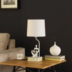 Modern Reader Sitting Stack of Books Polyresin 20.5 in. White Table Lamp by ORE International -Armacost Lighting Shop white ore international table lamps hbl2545 4f 1000